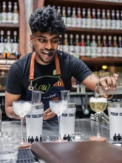 Our mixologist presenting a new cocktail creation during a competition. This highlights the level of expertise and passion for innovation within our team.
