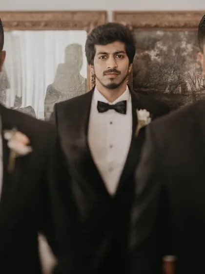 A cool, confident portrait of the groom and his groomsmen. The composition and their serious expressions give this a stylish, cinematic feel.