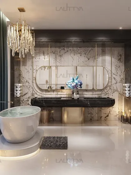 A spa-like bathroom where a freestanding tub sits on a custom marble platform near a large window. The black marble double vanity with gold accents creates a sophisticated contrast against the textured walls, all under a cascading crystal chandelier.