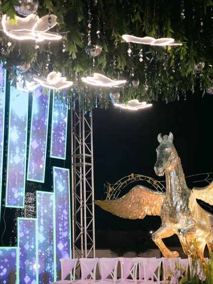 A magical sangeet decor detail featuring a glittering Pegasus statue. We use unique statement pieces like this to bring a touch of fantasy and extravagance to your event.