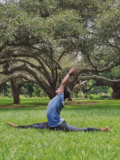 Finding my full expression of Hanumanasana (Monkey Pose) in the lush grass of Lalbagh. The body remembers, even after a break.