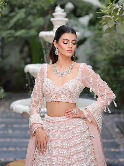 Another beautiful shot showcasing the flawless makeup and the intricate details of her outfit.