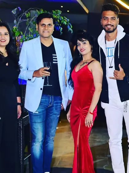 Posing with friends and supporters at the Mrs. Worldwide success party. A strong community is a key part of every fitness and life achievement.