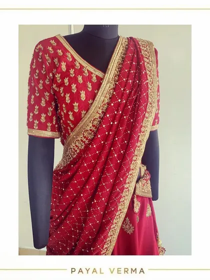 A closer look at the hand-embroidered blouse and mukaish dupatta of the oxblood lehenga set, showcasing the luscious details and craftsmanship.