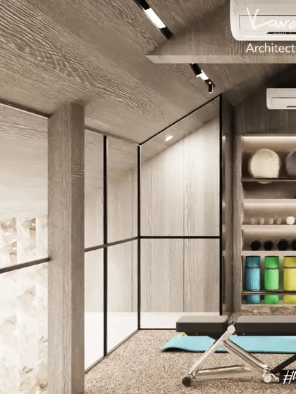 Another angle of the attic gym, showing the glass partition that separates the workout area from the rest of the space while maintaining an open feel.