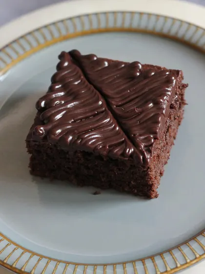 A slice of our rich, cakey brownie with a glossy chocolate frosting. Our class covers both fudgy and cakey brownie types to suit all preferences.