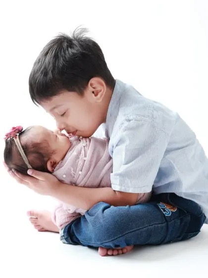 Welcoming a new baby is a milestone for the whole family. Capturing the gentle curiosity and instant love of an older brother meeting his newborn sister for the first time is a story I am always honored to tell.