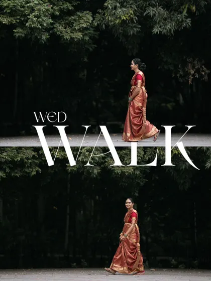 An artistic shot of the bride walking, framed by the dark, natural foliage to create a dramatic and elegant "Wed Walk" portrait.