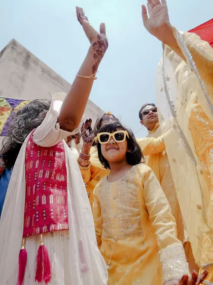 The energy and excitement of the Haldi celebration, with guests dancing and enjoying the festivities.
