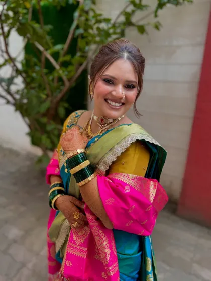 A joyful, candid shot of the bride. Her smile says it all. The makeup is designed to last through smiles, tears, and everything in between.