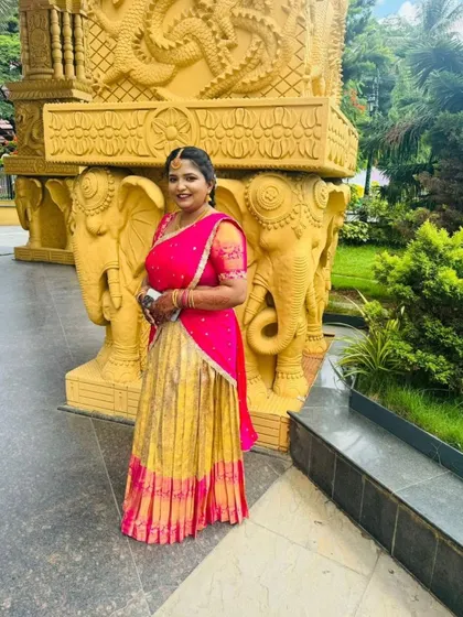 Our client Swathi looks beautiful in her custom pink and yellow half saree.