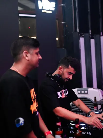 A B2B set in progress, with both of us focused on the mix. Teamwork makes the dream work, especially on the dance floor.