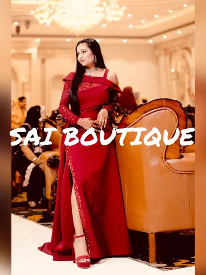 A powerful and elegant look in this custom red gown. The design features a thigh-high slit and an asymmetrical shoulder, perfect for a confident, modern woman.