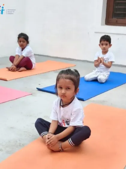 Children practice the butterfly pose during our Yoga Day celebration. Yoga helps improve flexibility, balance, and body awareness.
