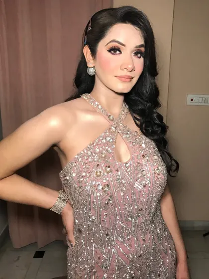 This engagement bride is ready to shine in her pink sequined gown, paired with simple but elegant diamond jewelry.