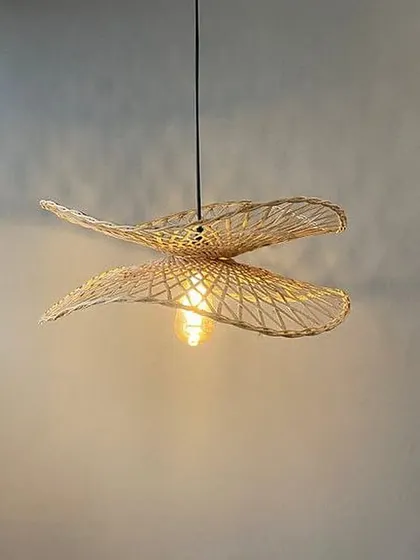 A beautiful pendant light made from woven bamboo or rattan. This fixture casts a warm, patterned light and adds a natural, airy feel to the room.