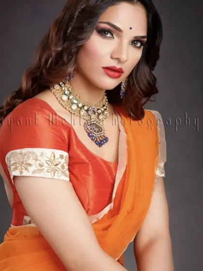 A classic photoshoot look with a bold red lip and soft smokey eye, perfect for a traditional yet glamorous fashion feature.