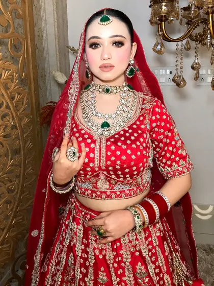 The complete bridal look, showcasing the intricate jewelry and the flawless, long-lasting HD makeup.