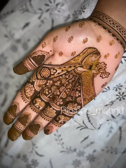 The same beautiful 'dulhan' design, but with added filler patterns. The small 'booti' dots around the figure and the shaded details in her dress give the design more depth and richness.
