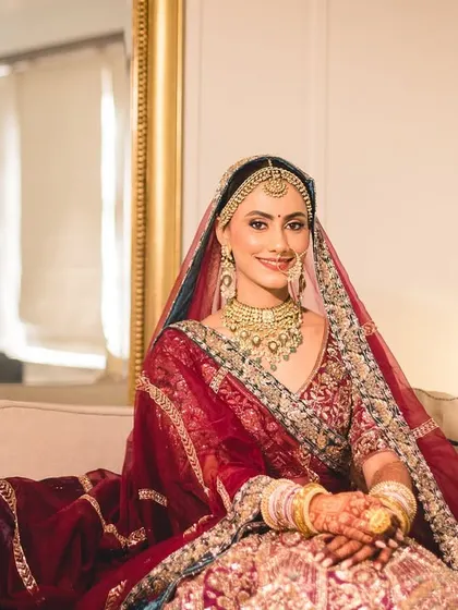 The bride, Bhavita, looking regal and serene as she gets ready for her wedding ceremony.