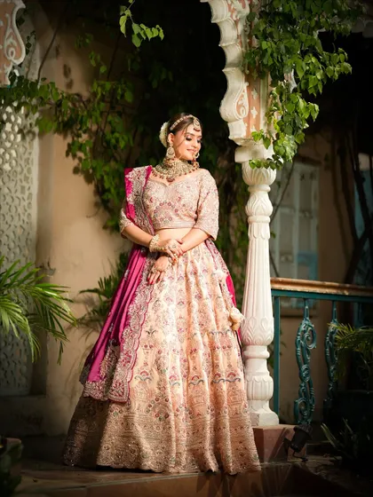 A full-length shot in a beautiful outdoor setting. The makeup looks just as stunning in natural light.