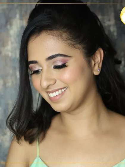A beautiful, smiling shot that shows how the makeup looks when you express yourself. The glam eye makeup is balanced with a soft, natural skin finish.