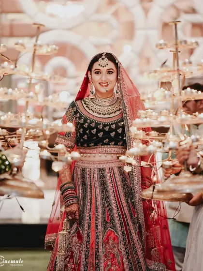 The bride's entrance, surrounded by traditional diyas, creates a stunning and spiritually significant visual.
