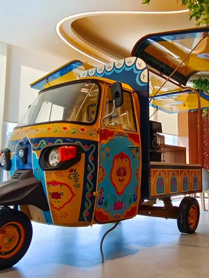 The final reveal. Fully transformed, the auto-rickshaw stands as a vibrant explosion of color and culture, complete with custom canopies and details that honor the spirit of Indian street art.