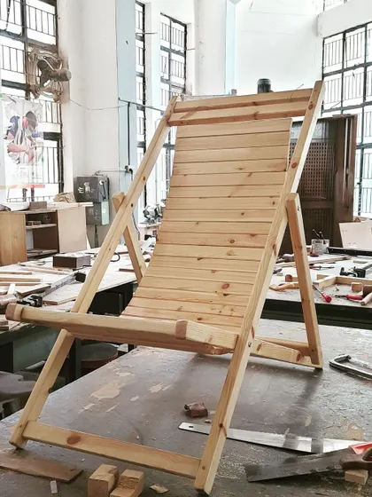 Another angle of the solid wood deck chair, highlighting the clean lines and sturdy construction achieved by our diploma students.