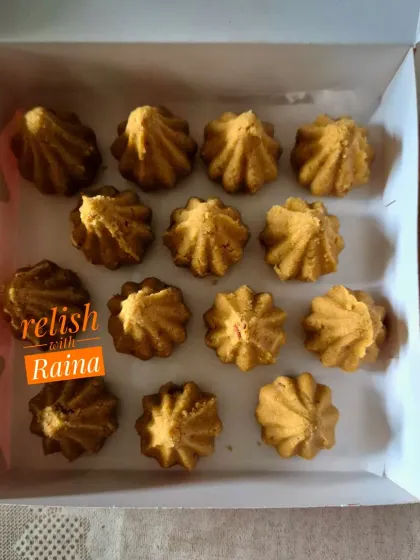 A closer look at the Besan Modaks. The shape is achieved using a traditional modak mould, and the roasting of the besan is key to its flavor.