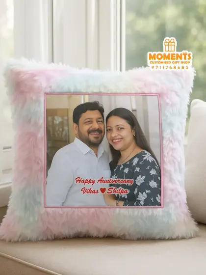 Cuddle up with your memories. This soft fur cushion is personalized with a couple's photo and an anniversary wish.