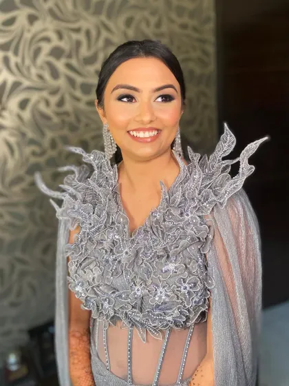 When the bride's smile lights up the room. Bansi was a showstopper at her reception in this avant-garde grey gown, and I gave her a smokey eye to match the drama.