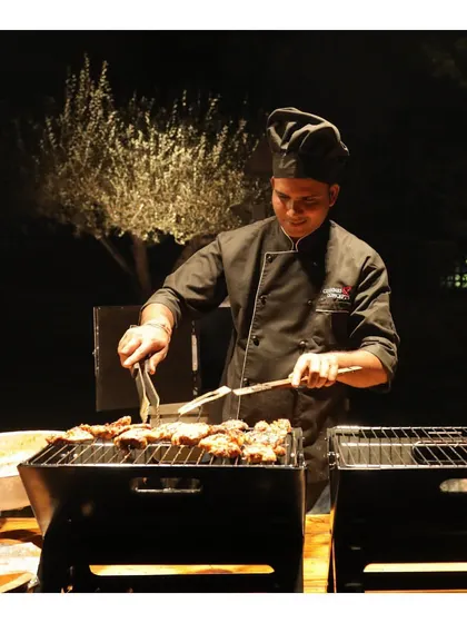 Another view of our live barbecue station, where our chef expertly tends to the grilling meats, ensuring each piece is juicy and flavourful.