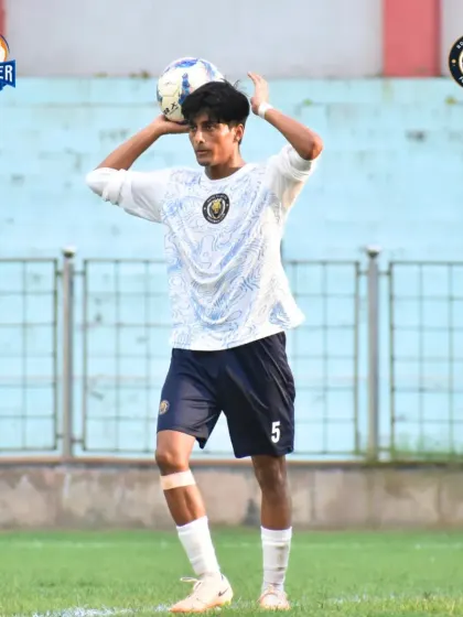 A player prepares for a throw-in, a crucial moment to restart play and build an attack.