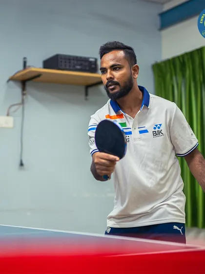A coach in action, ready to return any serve with dominance. My table tennis coaching is open for all ages and skill levels.