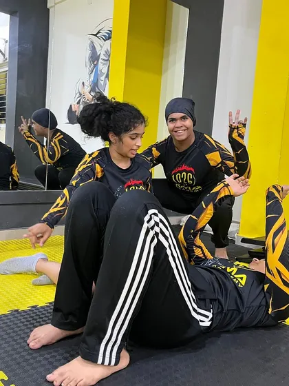 Two female members drilling a BJJ technique. Our academy is a welcoming place for women to learn the art of jiu-jitsu.