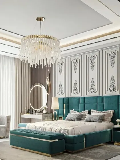 This bedroom design combines classic luxury with bold color. The tufted teal bed frame, ornate wall panels, and crystal chandelier come together to create a glamorous and unforgettable master suite.