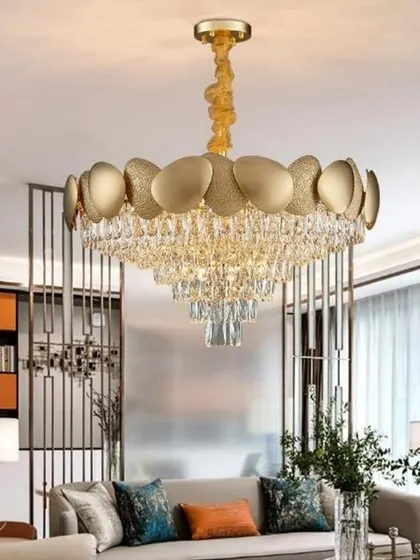 A modern crystal chain chandelier with a round gold frame. This fixture is perfect for contemporary living rooms, offering a stylish blend of metallic shine and crystalline sparkle.