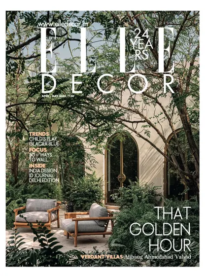 The cover of Elle Decor's April-May issue, featuring the lush garden and inviting arches of our Dua Villa project in Alibaug.