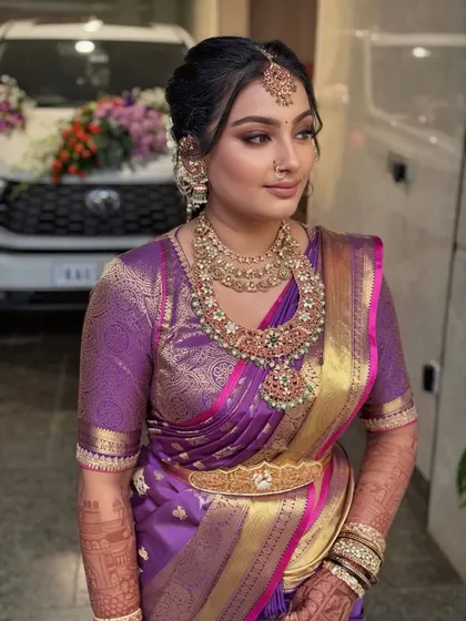 This bride embodies grace in every detail. Her makeup is designed to be both timeless and bold, a perfect symphony of heritage and modern style for a South Indian wedding.