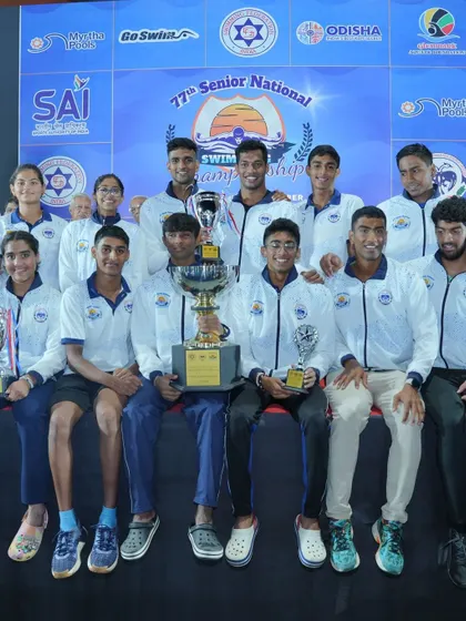 Team Karnataka celebrating their overall championship win.