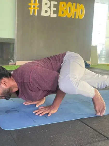 Working on the side crow pose (Parsva Bakasana) on the mat. This arm balance is a great way to build strength, focus, and a bit of sweat.