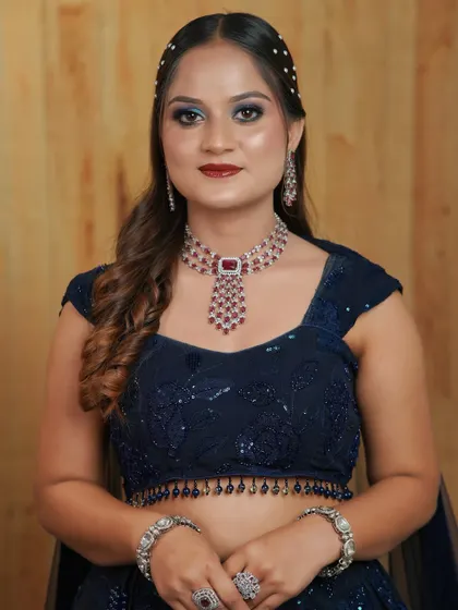 A full-face shot of this stunning party makeup. The bold eyes and lips are balanced with a clean base and contoured cheeks.