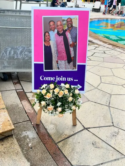 Directional signs with photos help guide guests through the venue while adding a personal touch to the event.