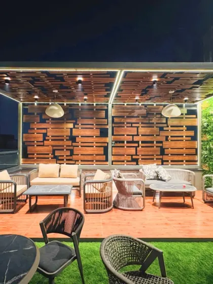 I transform outdoor areas into functional and stylish extensions of the home. This rooftop terrace features a custom wooden pergola, comfortable all-weather seating, and a vertical garden wall, creating a perfect urban oasis for relaxing or entertaining.
