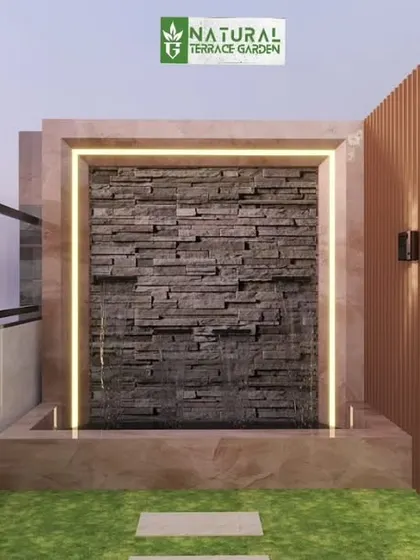 A proposed water feature with a stacked stone wall and an illuminated frame, designed to add a sense of calm.