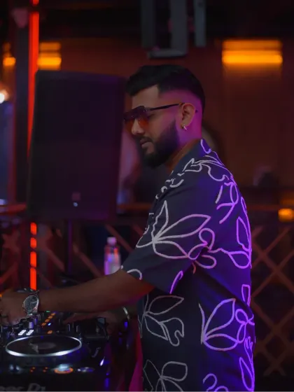 Deep in concentration, crafting the perfect mix for the dance floor.