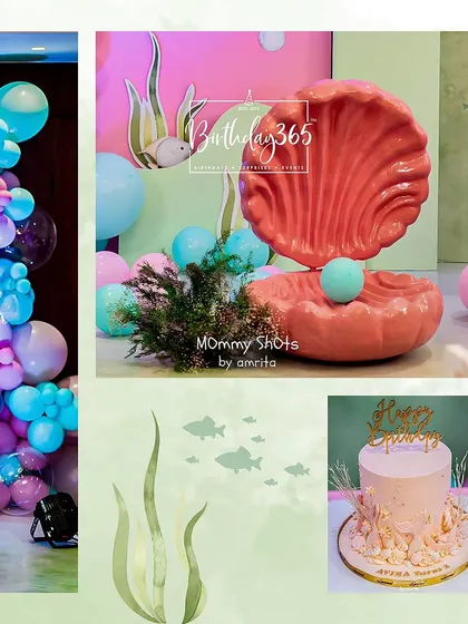 More details from Avira's party, including a large pink clamshell prop, a custom-themed cake, and a beautiful balloon garland.