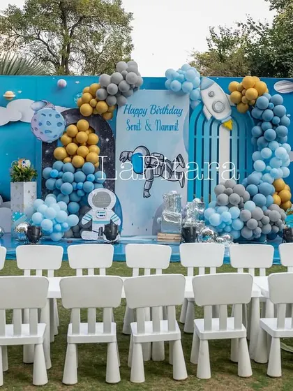 A dedicated kids' seating area in front of the main space-themed stage, ensuring the little guests have the best view in the house.
