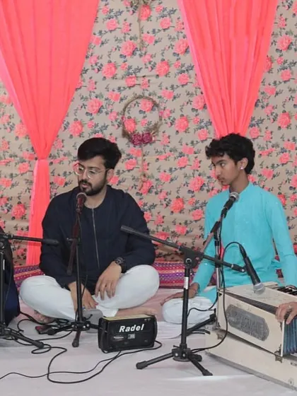 A student performance at 'Raghunathanjali', with accompaniment on harmonium.